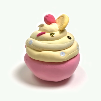 Sculpture of a Pink and Yellow Cupcake with Sprinkles and Cherry on Top