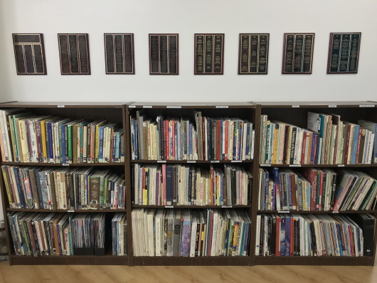 Bookshelves with Award Plaques Above