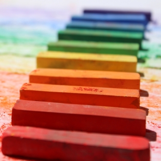 Row of chalk pastels in many colours.